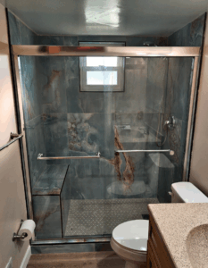 Hamilton custom tile shower after photo with bench by KR Remodeling